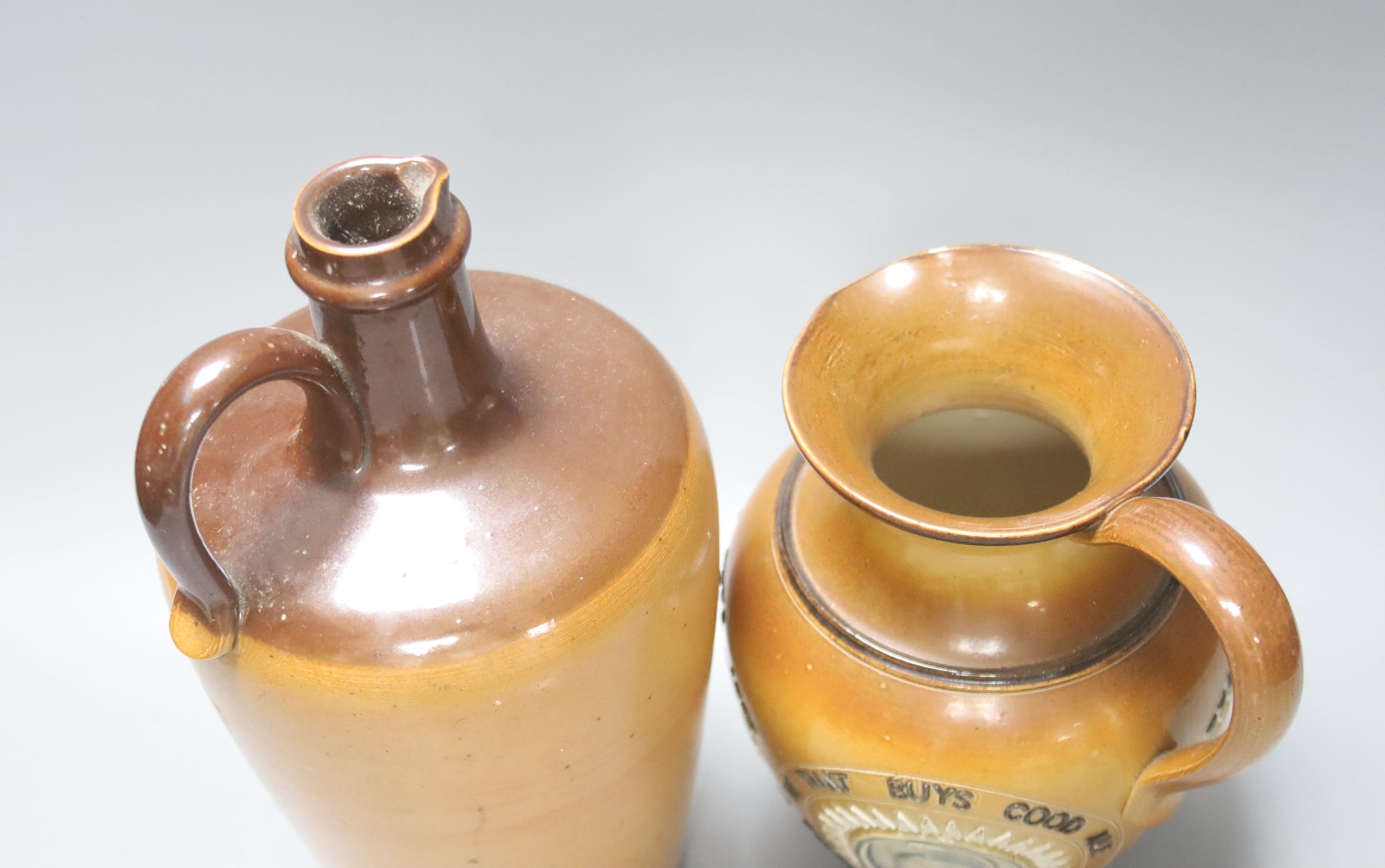 A Doulton Lambeth Angus Mackay's N.Y.O. stoneware flagon, 26cm, and a similar motto jug, 19cm